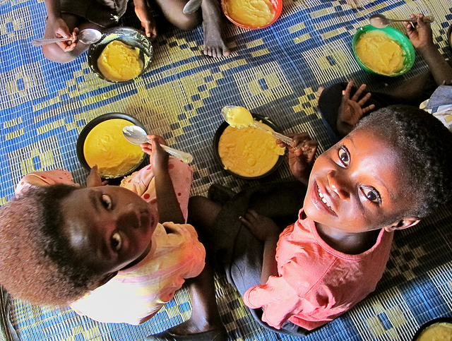 Two girls eating bio-fortified maize, Mukushi, Zambia. Photo: Silke Seco/DFID