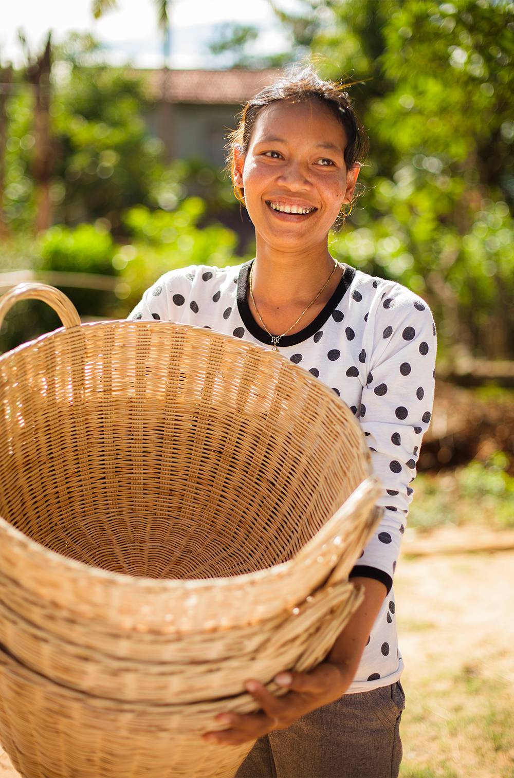 Woman holding baskets and smiling
